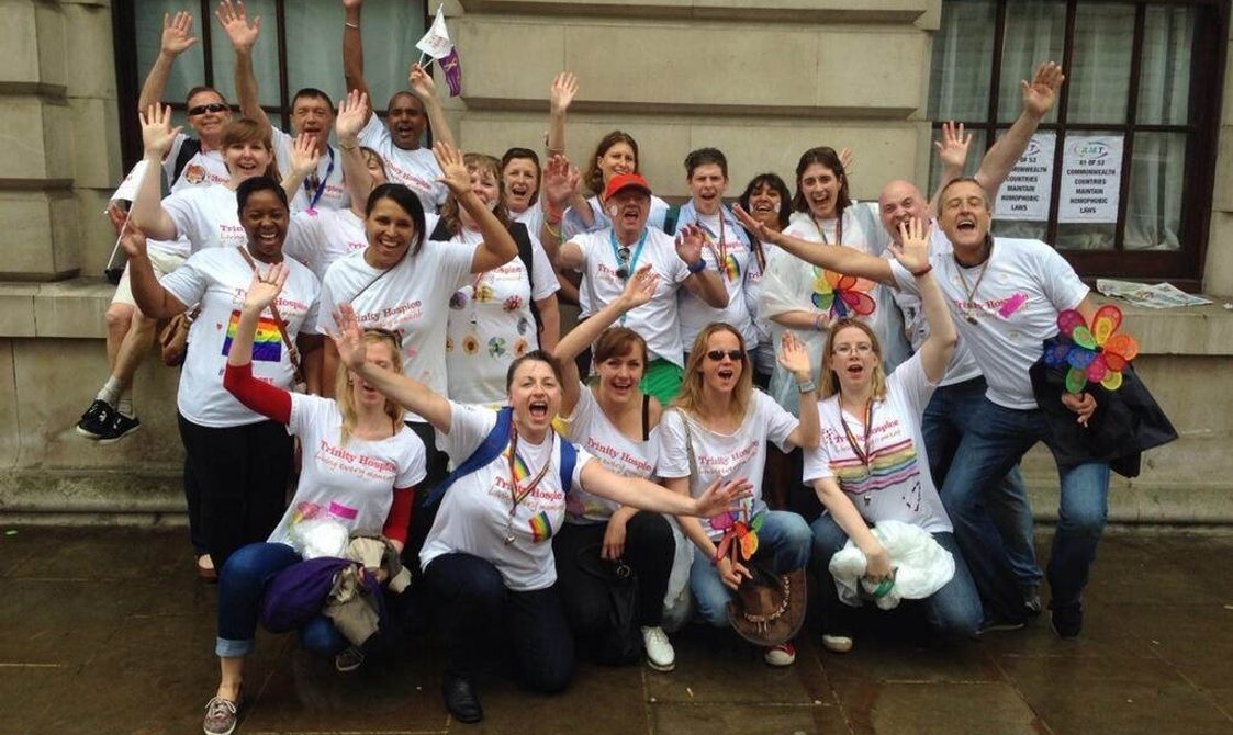 The Royal Trinity Hospice team cheering at the end of the Pride in London, 2016 parade.