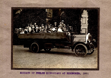 Charles Goss and other members of the Society of Public Librarians are all in one car, driving to a summer trip.