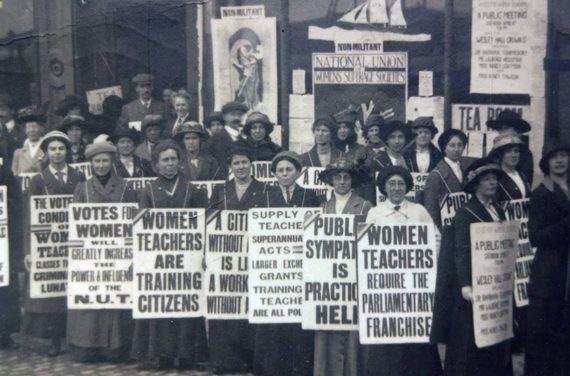 Black and white image of Clara Dawson at a Suffragette and NUWT rally.