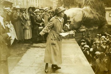 Black and white image of Agnes Dawson speaking to the crowd at a rally in Trafalgar Square, c.1924