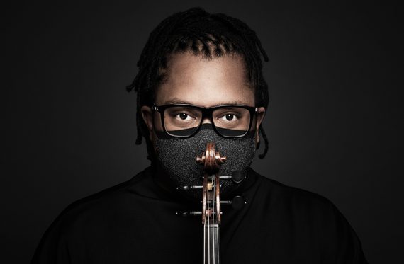 Press photo of violinist, Clifton Harrison with a facemask on.