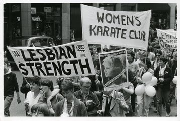 A photo from the Lesbian Strength March June 1981. The protestors are holding signs saying: "Lesbian Strength" and "Women's Karate Club".