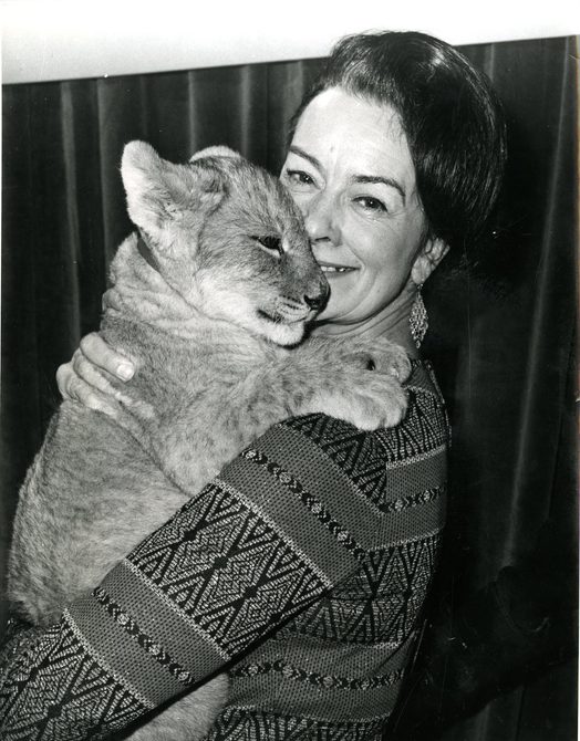 Peggy Spencer holding a lion cub.