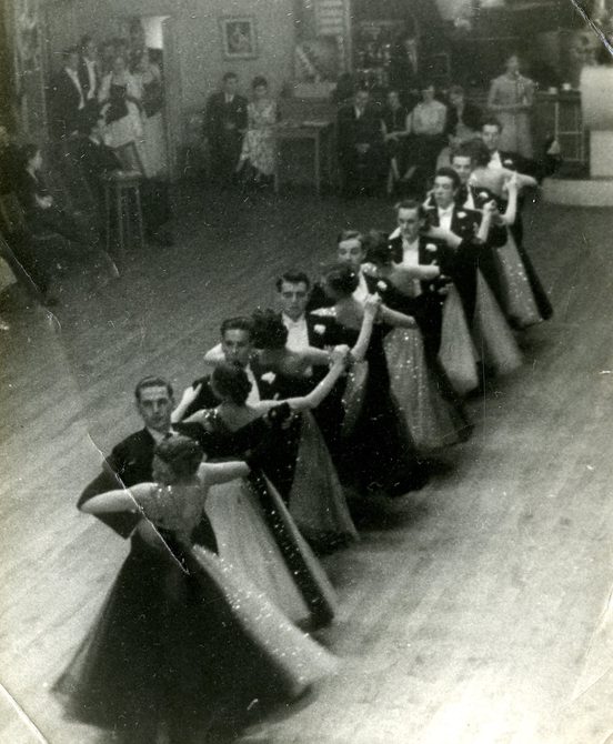 A black and white photo of the original Penge team performing.