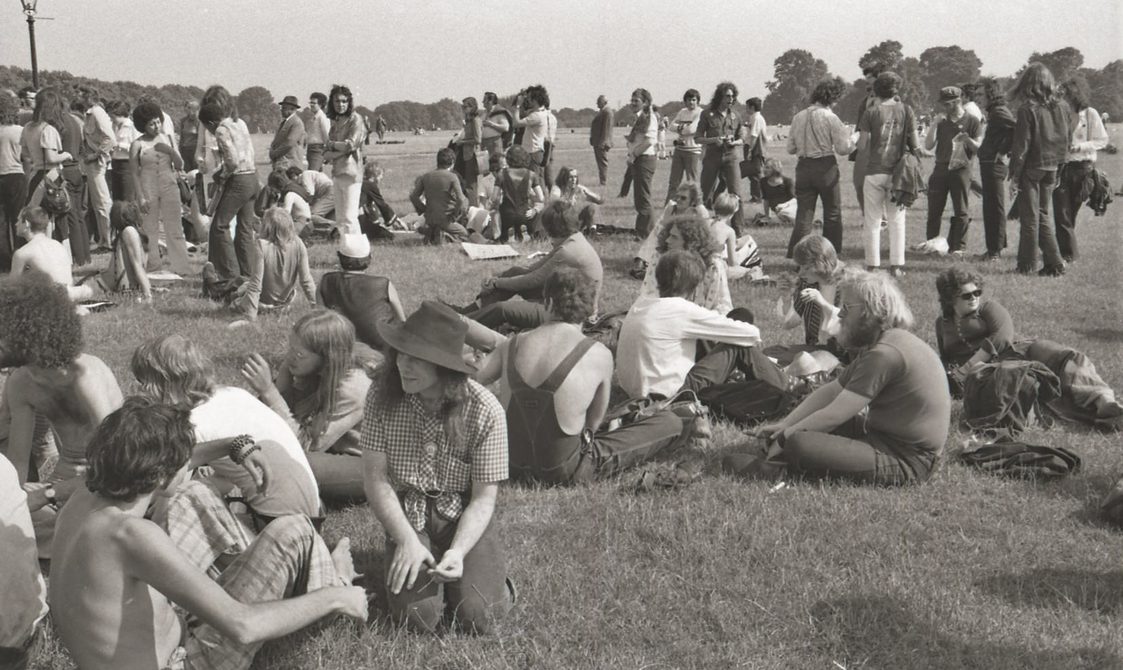 A picture from the second Pride march in 1973. A group of protestors are sitting in Hyde Park.