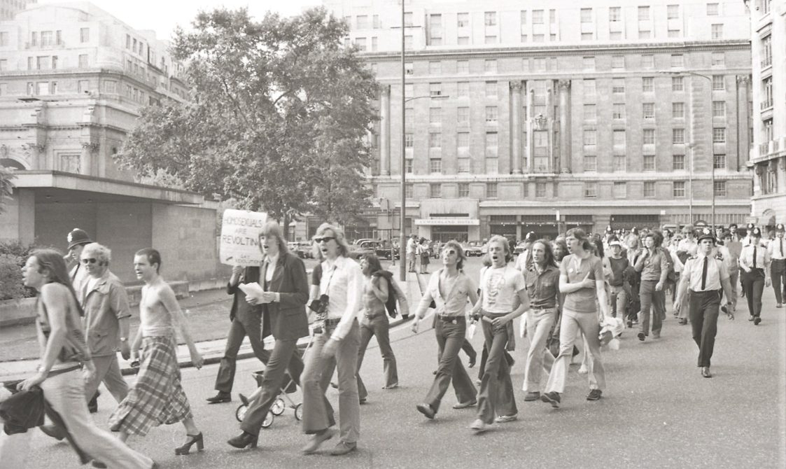 A picture from the second Pride march in 1973. A group of people are marching down from Embankment to Hyde Park.