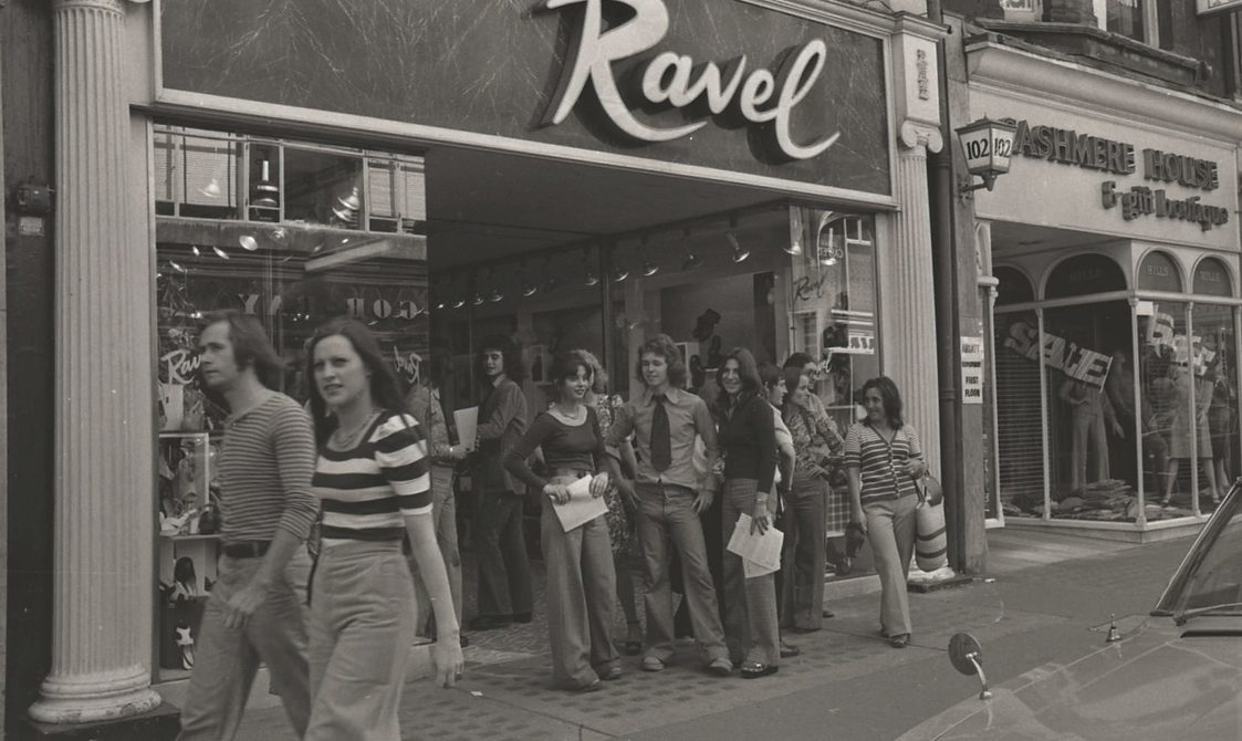 A picture from the second Pride march in 1973. Marchers are outside the shop Ravel.