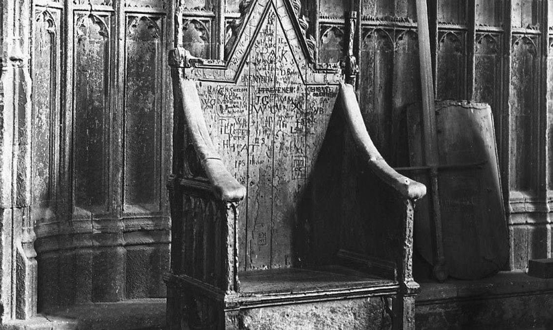 Coronation Chair in Westminster Abbey (note the graffiti, the work of Westminster schoolboys and visitors) c.1910