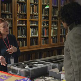 A Bishopsgate archivist discusses items from the archives with a member of the public.