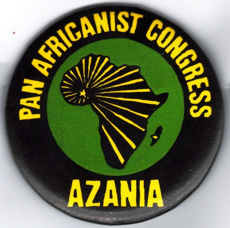 A PAC pin produced during the 1980s by the solidarity movement in the United States