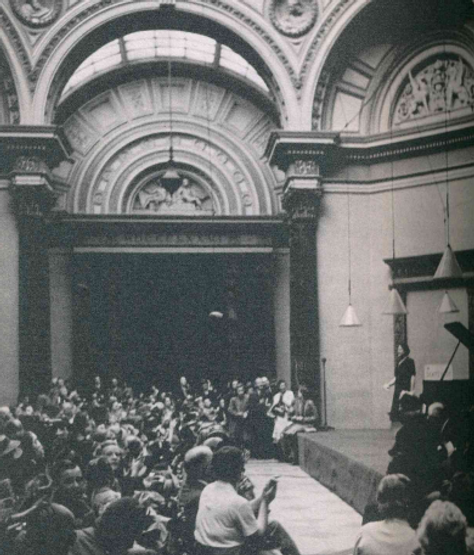 Black and white image of Myra Hess performing at the National Gallery.