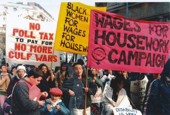 An image of a Wages for Housework protest march, showing women holding Wages for Housework banners.